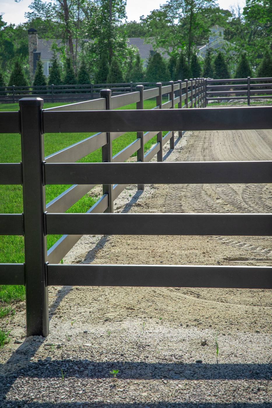 Close-up perspective of Buckley Fence steel rails and powder-coated finish