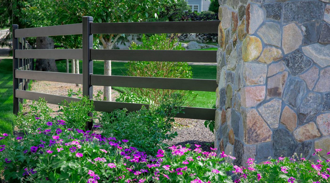 Buckley Fence with stone pillar and landscaping